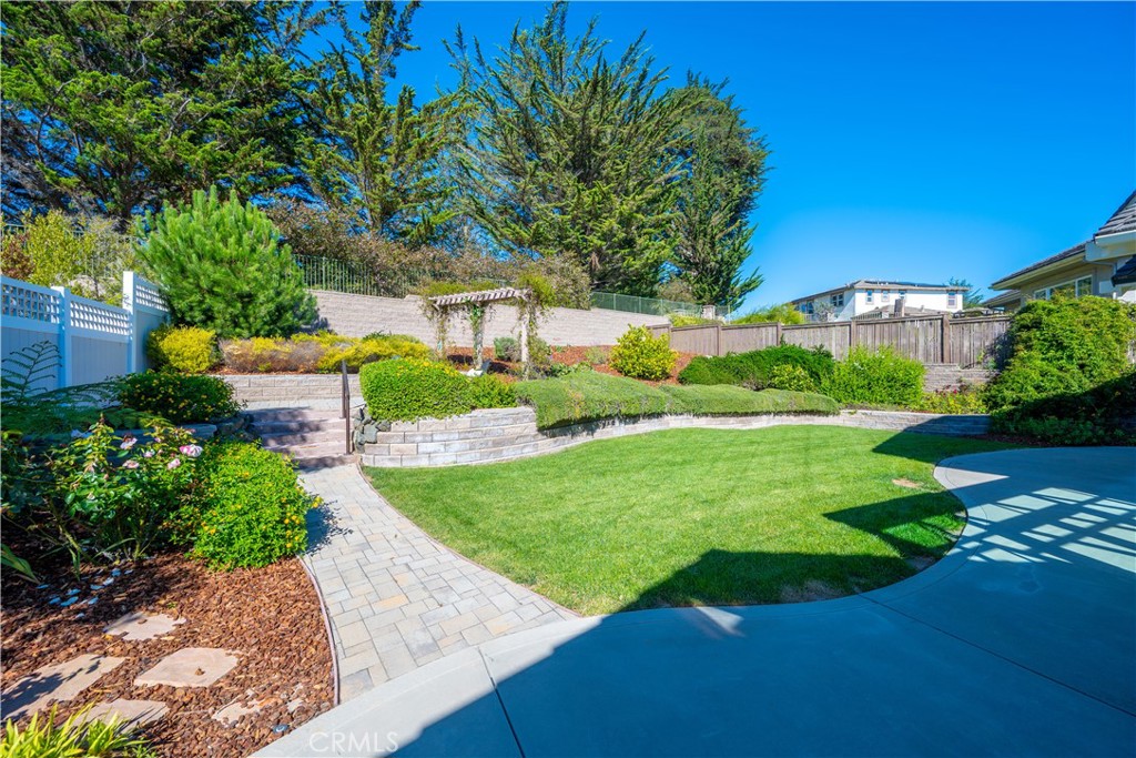 920 Wigeon Way Arroyo Grande, CA 93420 - Photo 37 of 57 a view of a garden with a building in the background