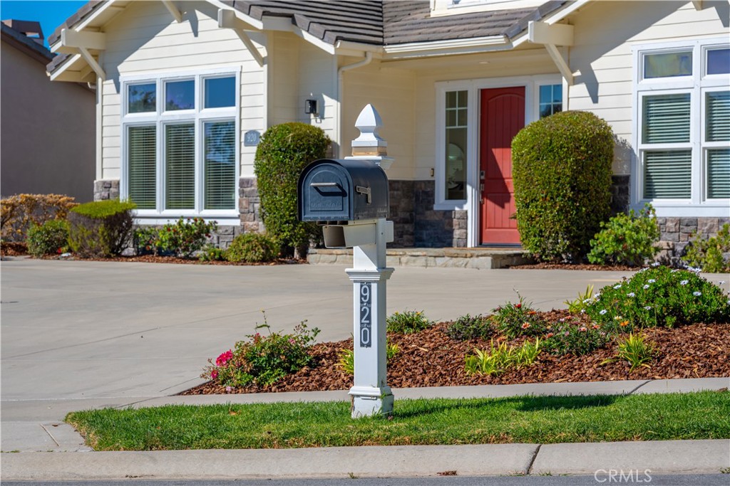 920 Wigeon Way Arroyo Grande, CA 93420 - Photo 49 of 57 a front view of a house with a yard and potted plants