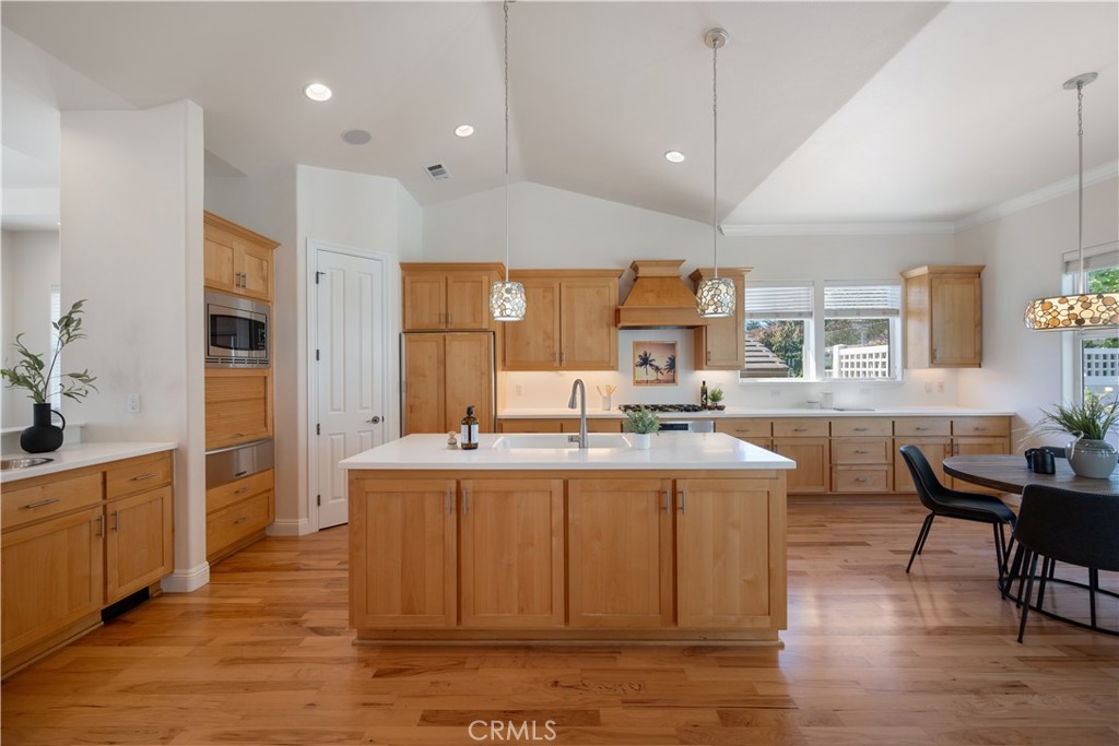 920 Wigeon Way Arroyo Grande, CA 93420 - Photo 5 of 57 a large kitchen with cabinets table and chairs