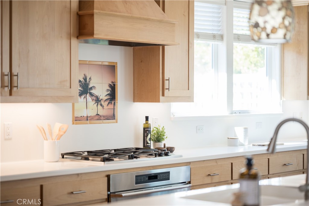 920 Wigeon Way Arroyo Grande, CA 93420 - Photo 6 of 57 a kitchen with granite countertop a stove and a sink