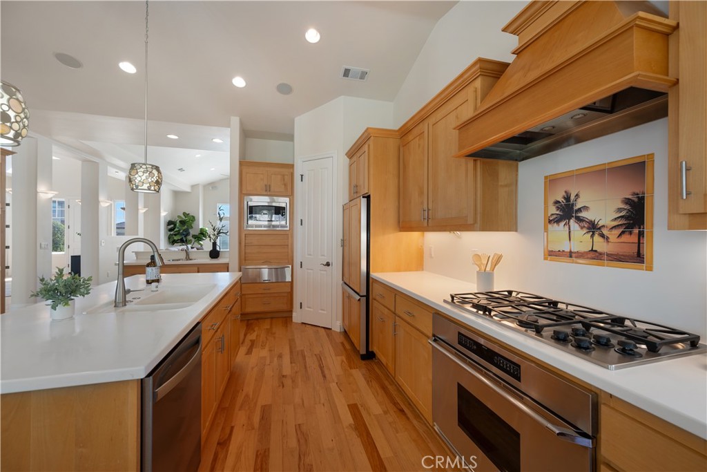 920 Wigeon Way Arroyo Grande, CA 93420 - Photo 8 of 57 a kitchen with stainless steel appliances granite countertop a stove and a refrigerator
