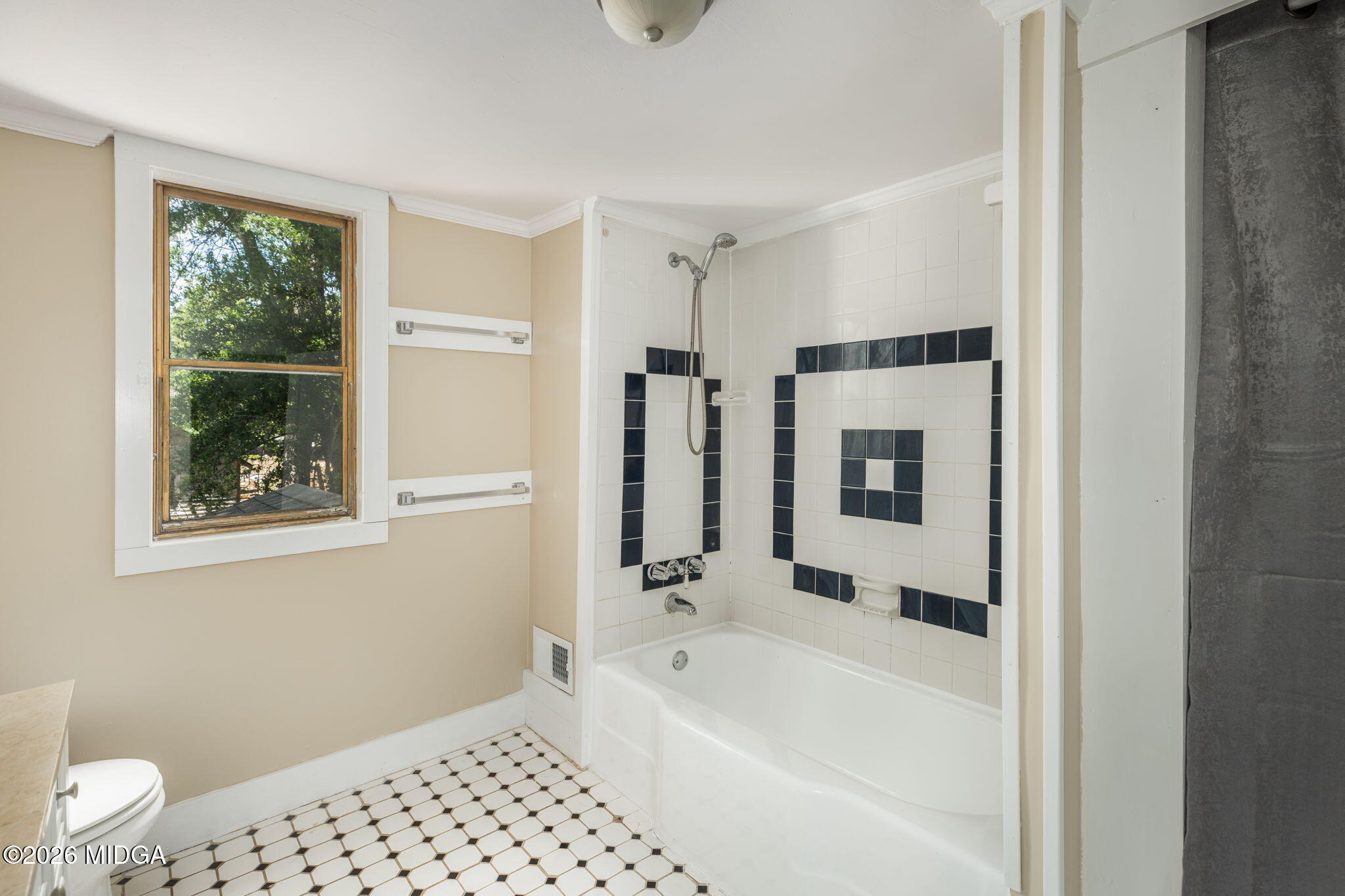107 Childs Street Gray, GA 31032 - Photo 29 of 37 a bathroom with a bathtub and a shower
