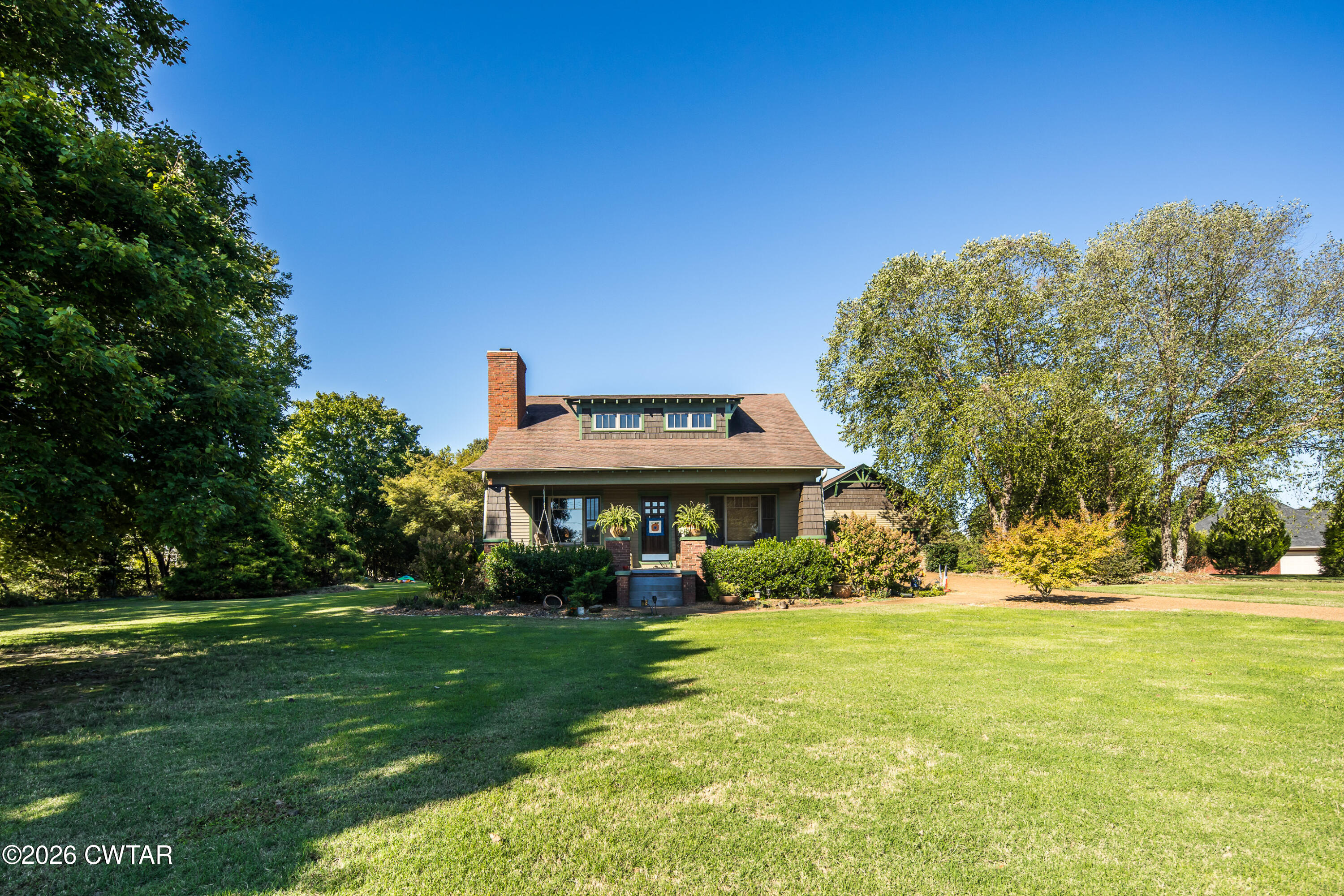 a view of a house with a big yard