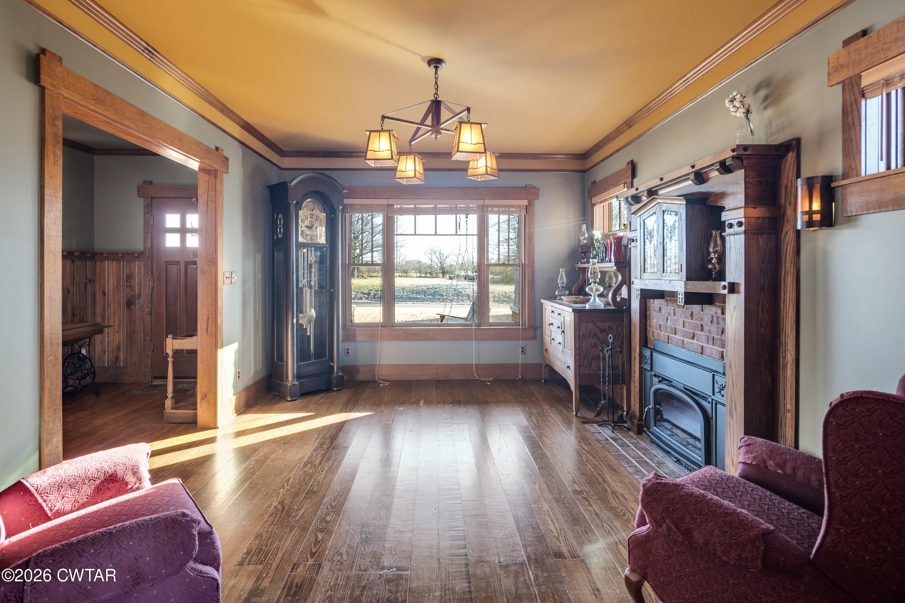 117 Pleasant Hill Road Humboldt, TN 38343 - Photo 11 of 45 a living room with furniture and a chandelier