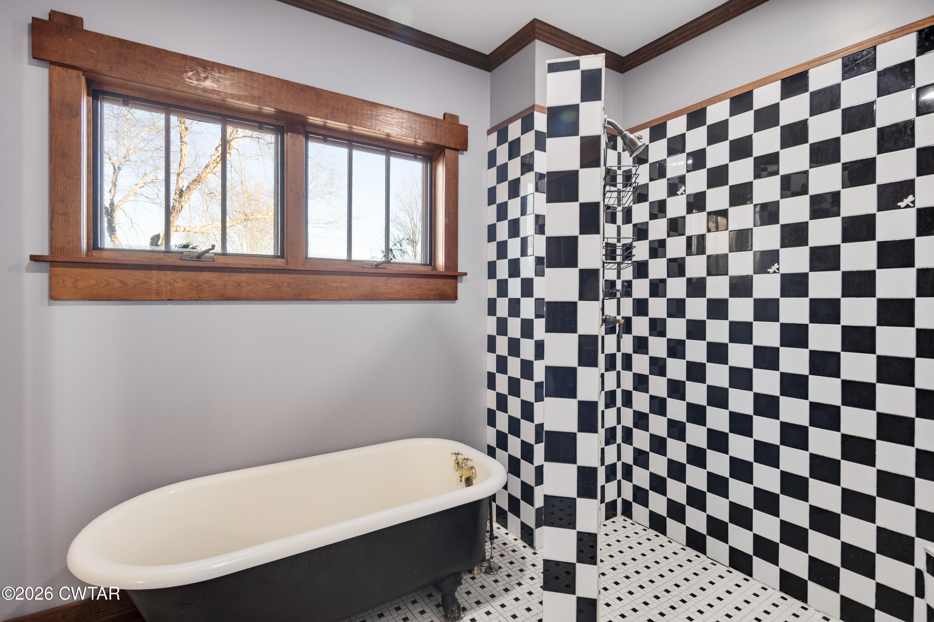 117 Pleasant Hill Road Humboldt, TN 38343 - Photo 16 of 45 a bathroom with a bathtub and a shower