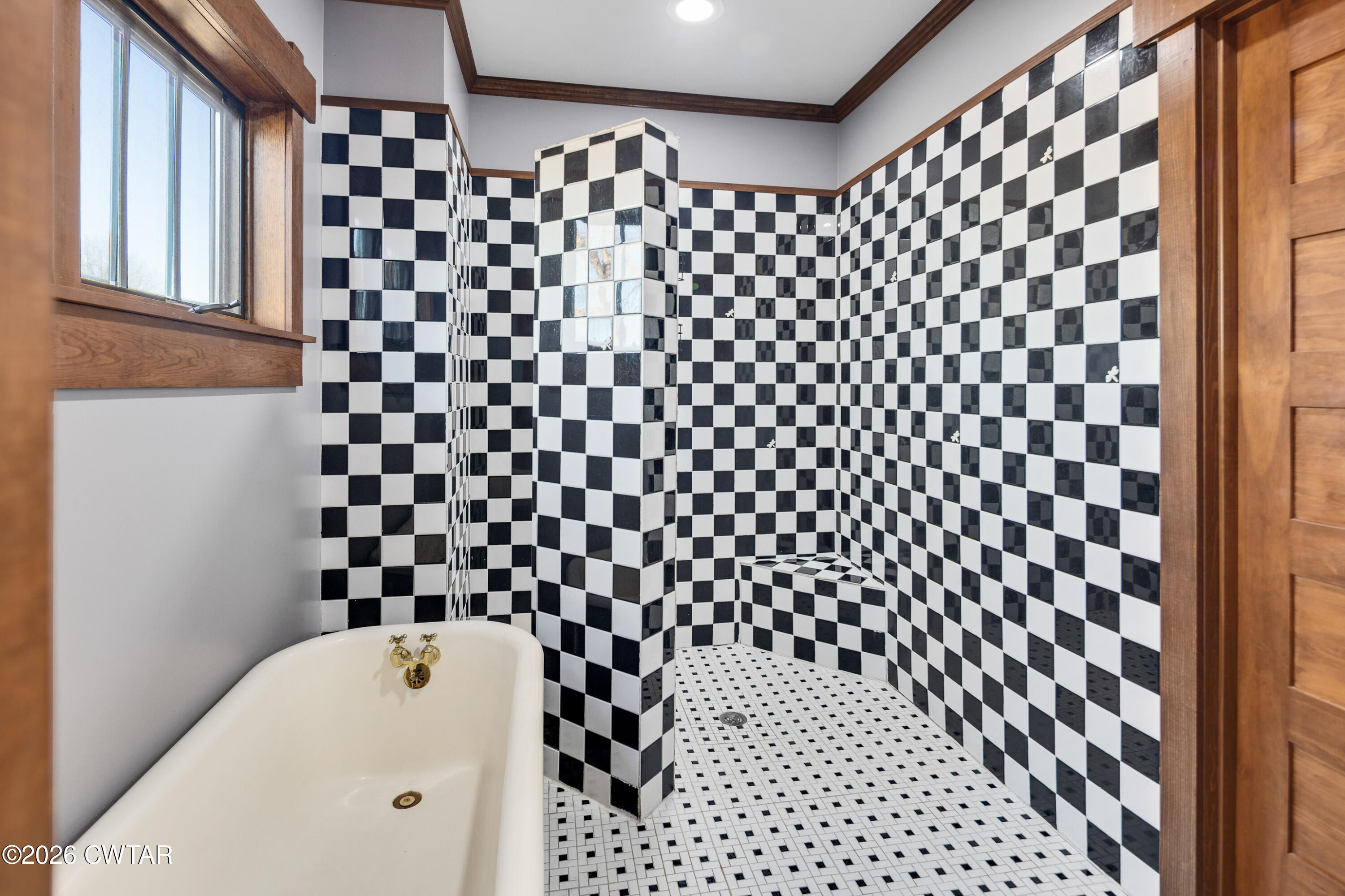 117 Pleasant Hill Road Humboldt, TN 38343 - Photo 17 of 45 a bathroom with a black and white checkered floor