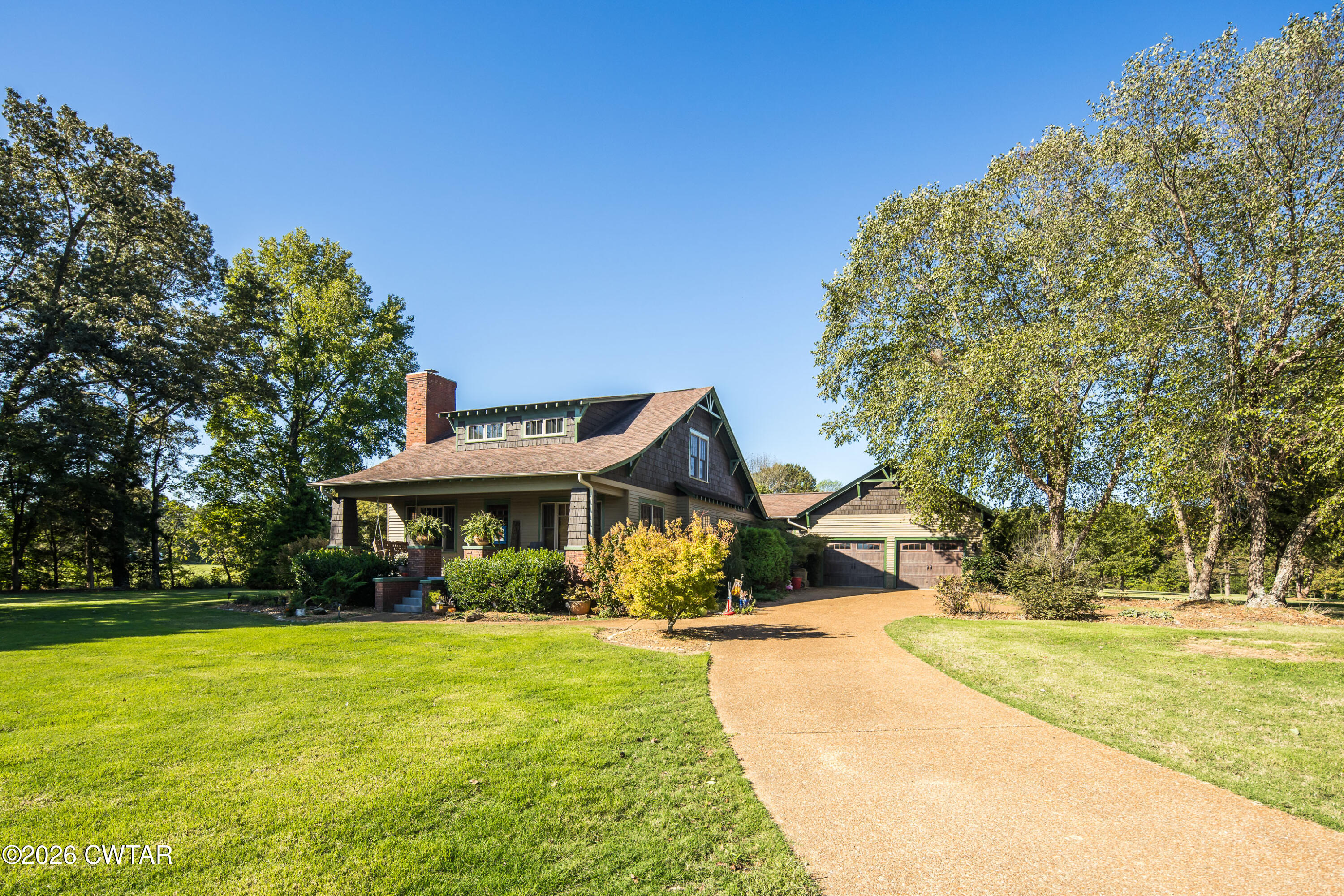 117 Pleasant Hill Road Humboldt, TN 38343 - Photo 2 of 45 a view of swimming pool and trees in the background