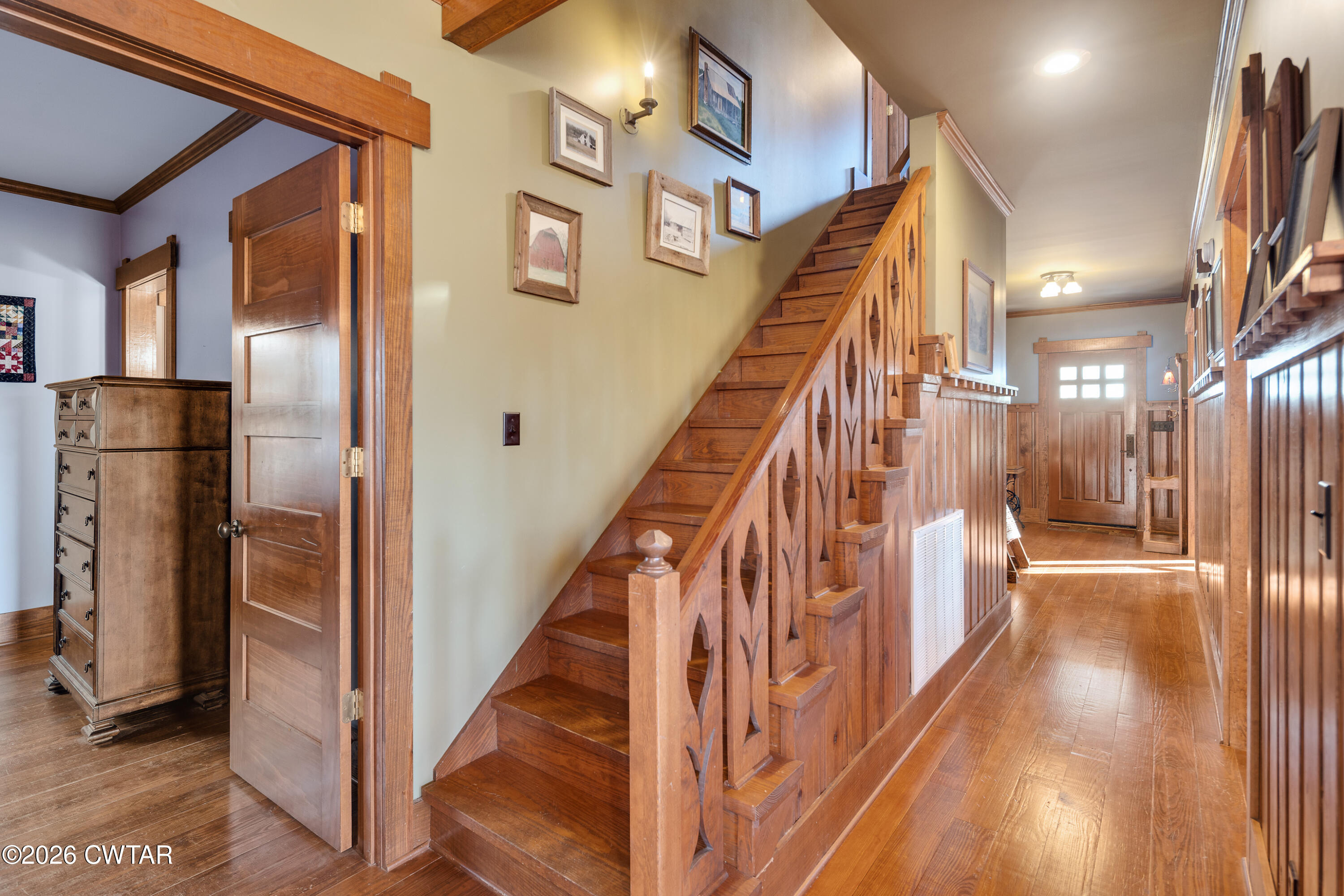 117 Pleasant Hill Road Humboldt, TN 38343 - Photo 24 of 45 a view of staircase with lots of frames on wall and wooden floors