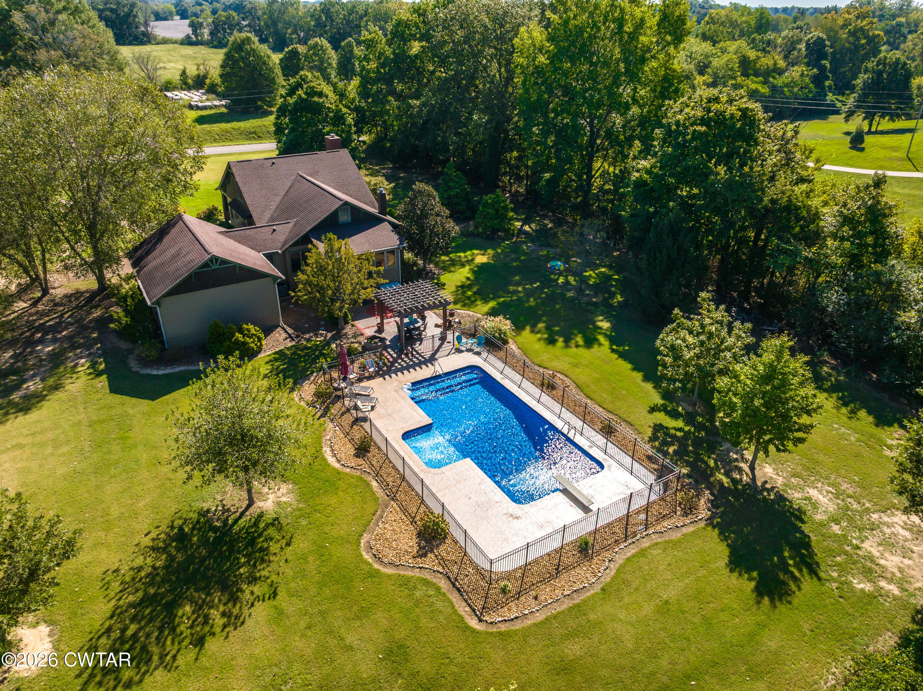 117 Pleasant Hill Road Humboldt, TN 38343 - Photo 31 of 45 an aerial view of a house with swimming pool and garden