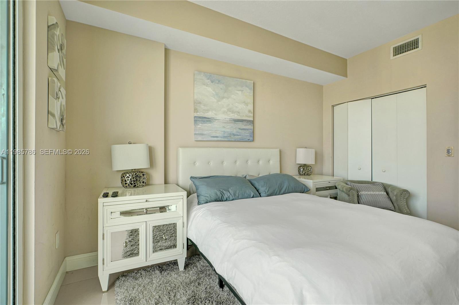 79 Southwest 12th Street, Unit 3412S Miami, FL 33130 - Photo 13 of 37 a bedroom with a bed and a cabinets