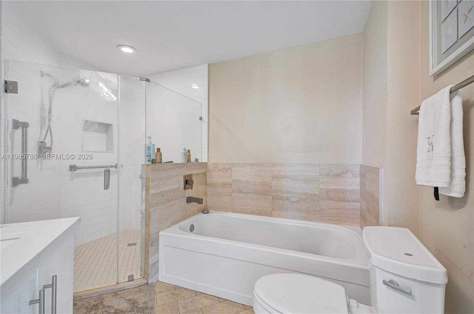 79 Southwest 12th Street, Unit 3412S Miami, FL 33130 - Photo 16 of 37 a bathroom with a toilet bathtub and shower