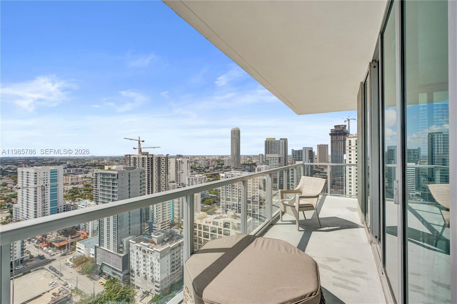 79 Southwest 12th Street, Unit 3412S Miami, FL 33130 - Photo 25 of 37 a view of a balcony with wooden floor