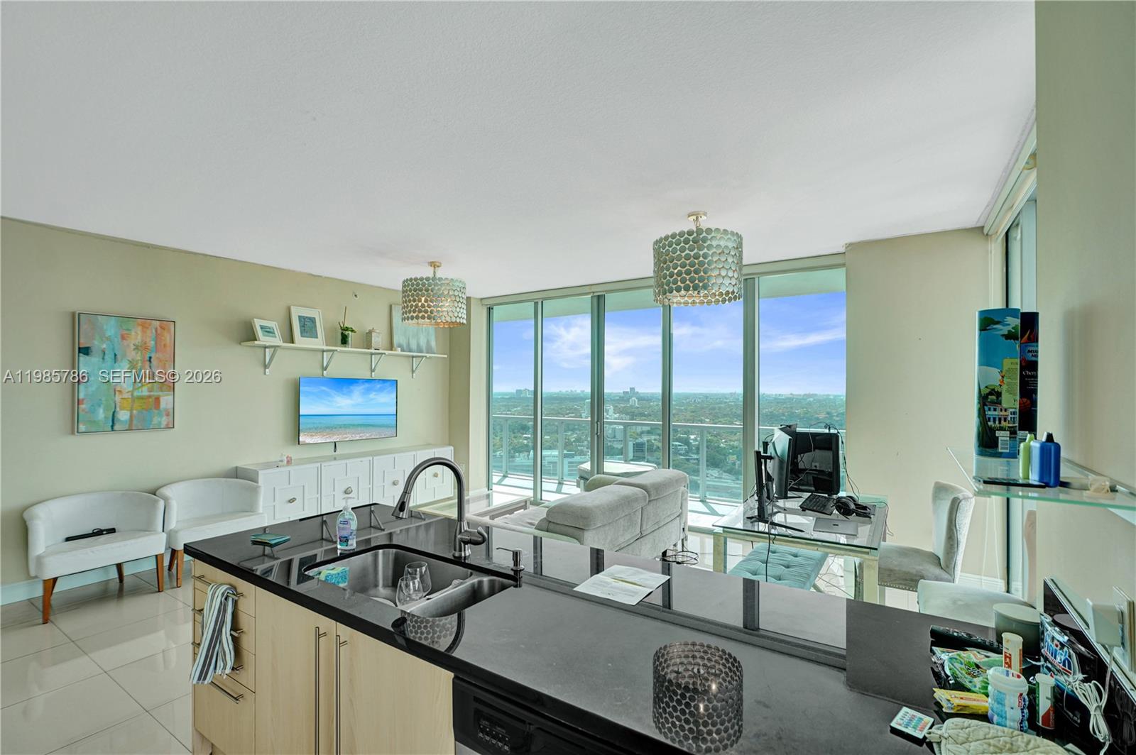 79 Southwest 12th Street, Unit 3412S Miami, FL 33130 - Photo 3 of 37 a kitchen with a table and chairs