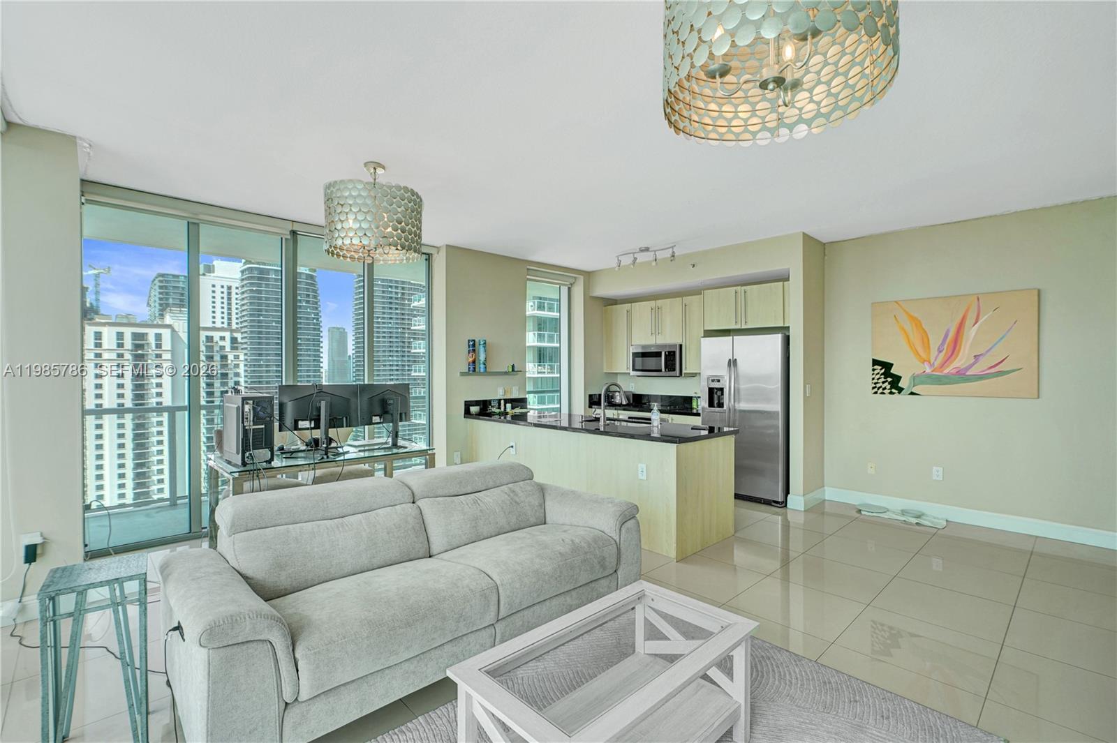 79 Southwest 12th Street, Unit 3412S Miami, FL 33130 - Photo 6 of 37 a living room with furniture and a large window