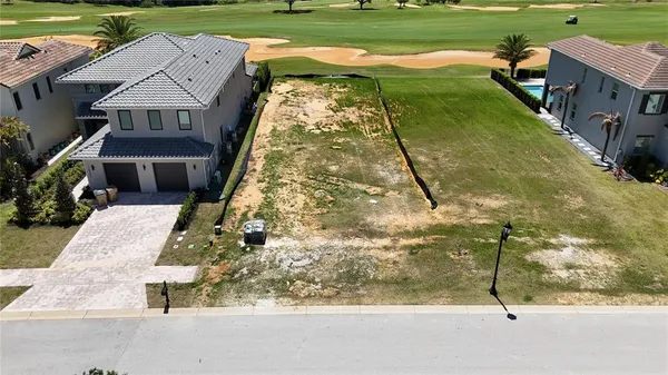 an aerial view of a house with pool outdoor seating yard and mountain view in back