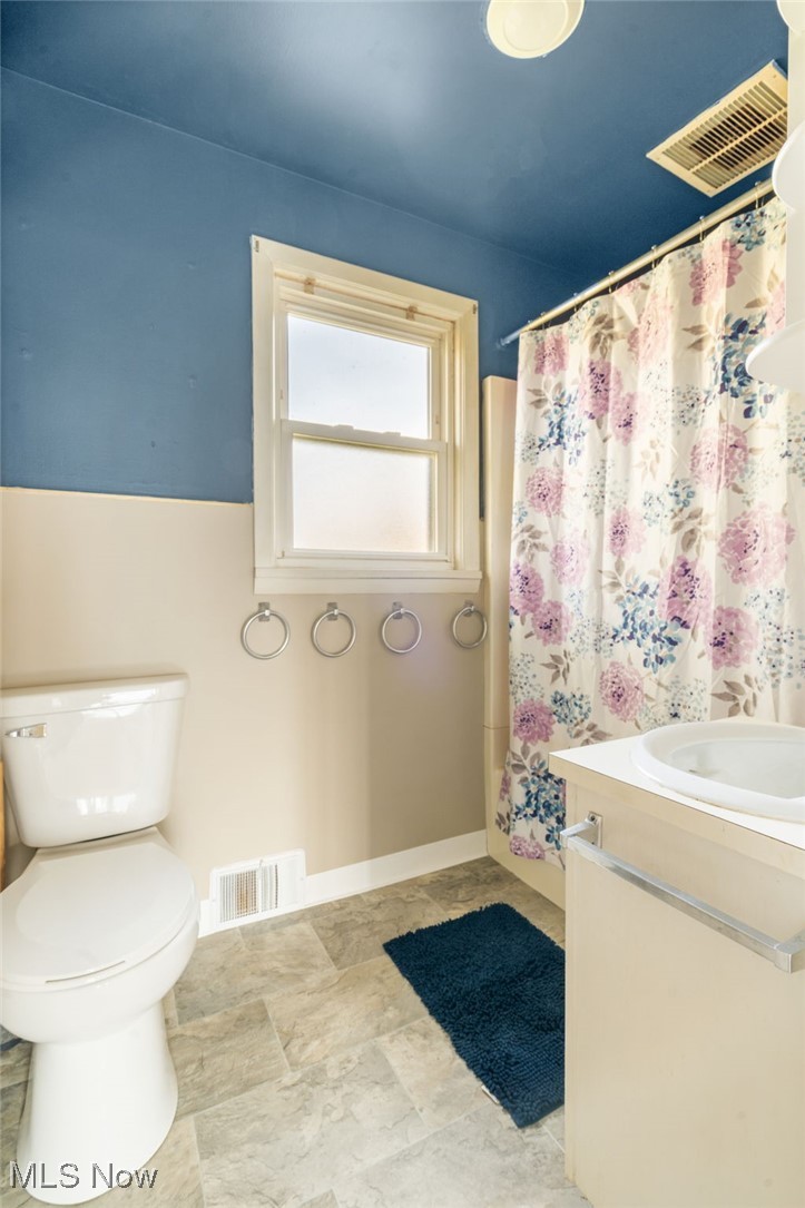 4491 Rock Spring Road Ravenna, OH 44266 - Photo 11 of 21 Bathroom with vanity, toilet, and walk in shower