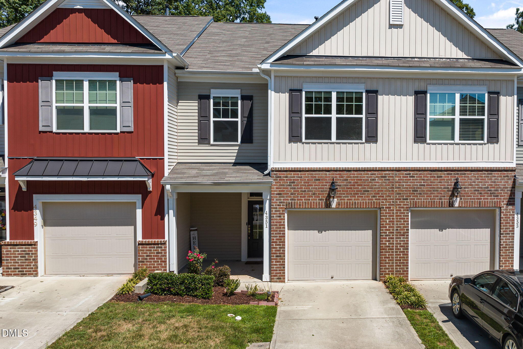 4351 Flintlock Lane Durham, NC 27704 - Photo 1 of 29 a front view of a house with a garden