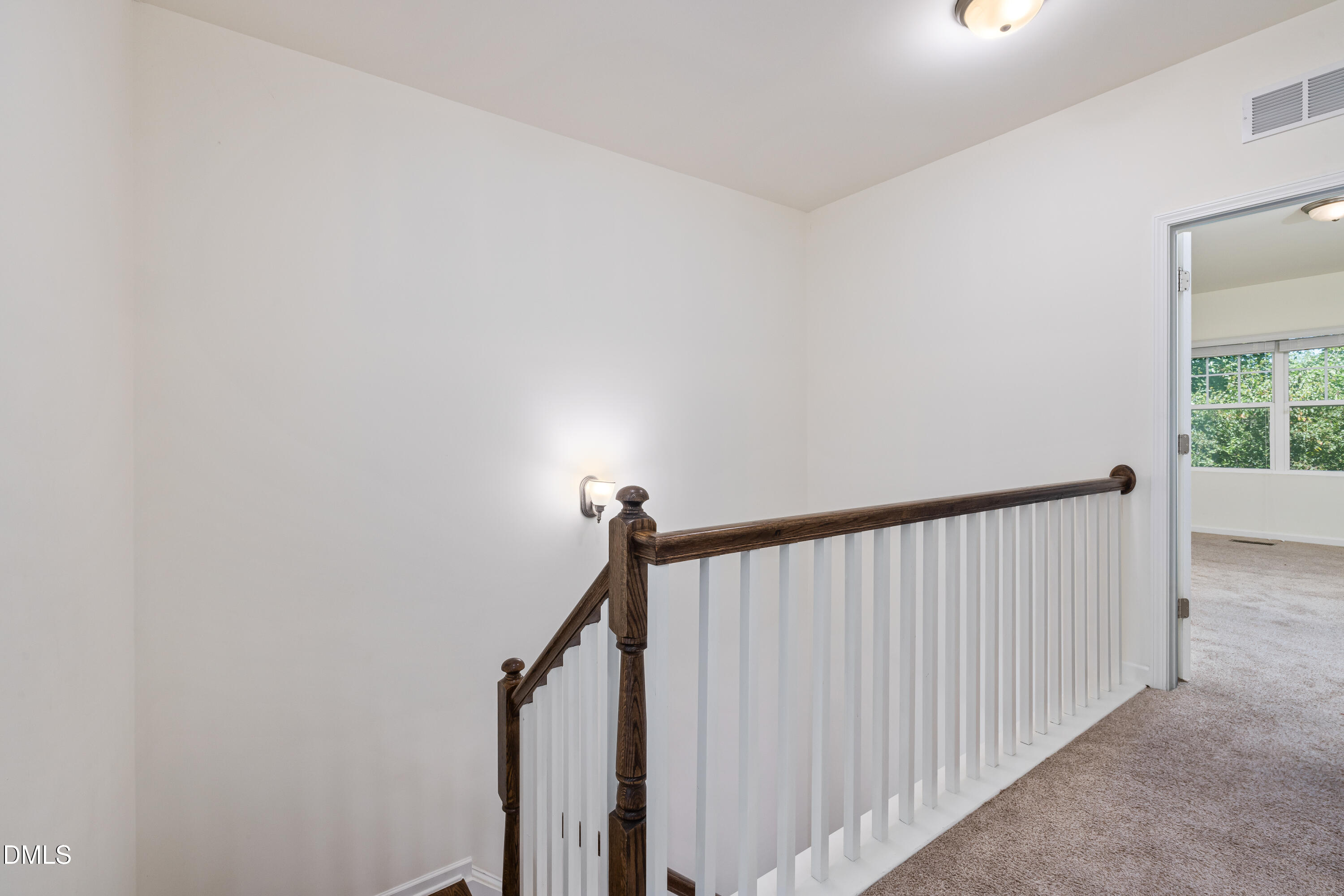 4351 Flintlock Lane Durham, NC 27704 - Photo 15 of 29 a view of hallway with stairs