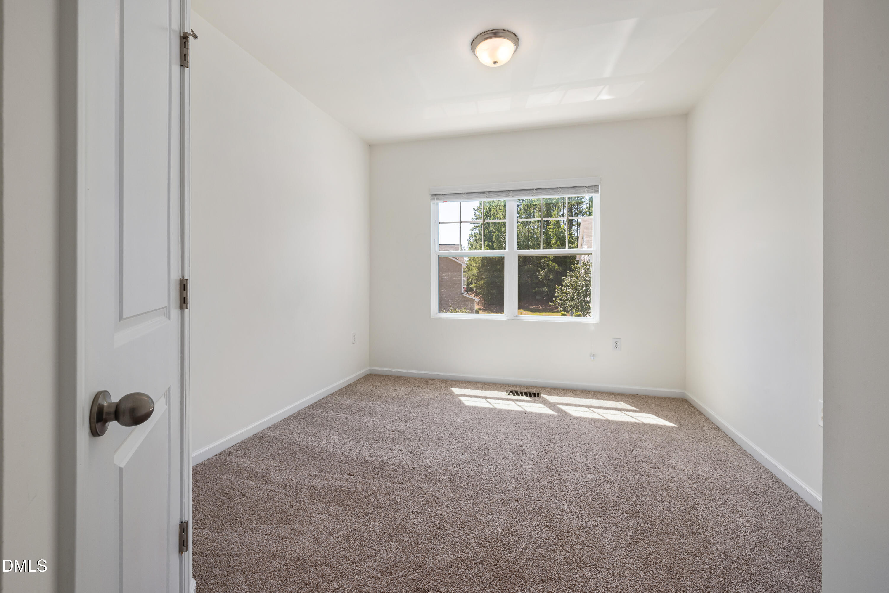 4351 Flintlock Lane Durham, NC 27704 - Photo 16 of 29 a view of an empty room with a window