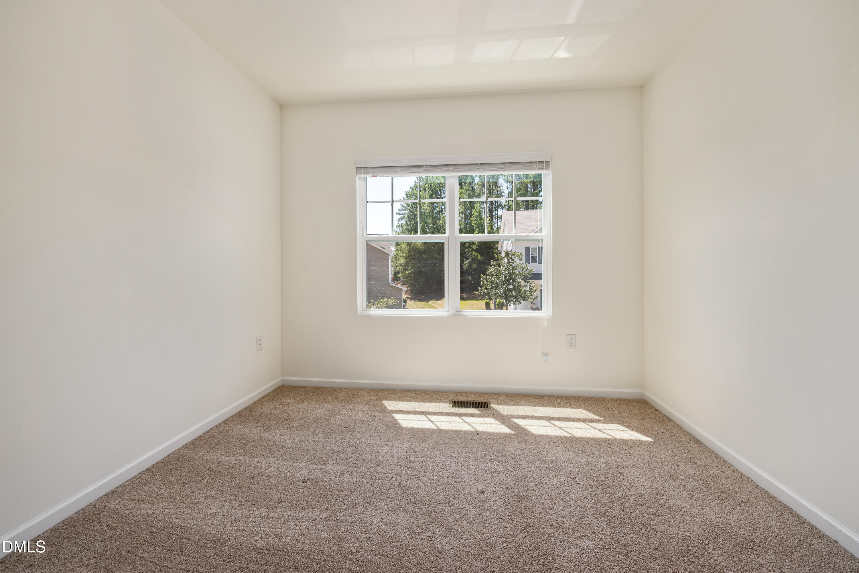 4351 Flintlock Lane Durham, NC 27704 - Photo 17 of 29 an empty room with a window