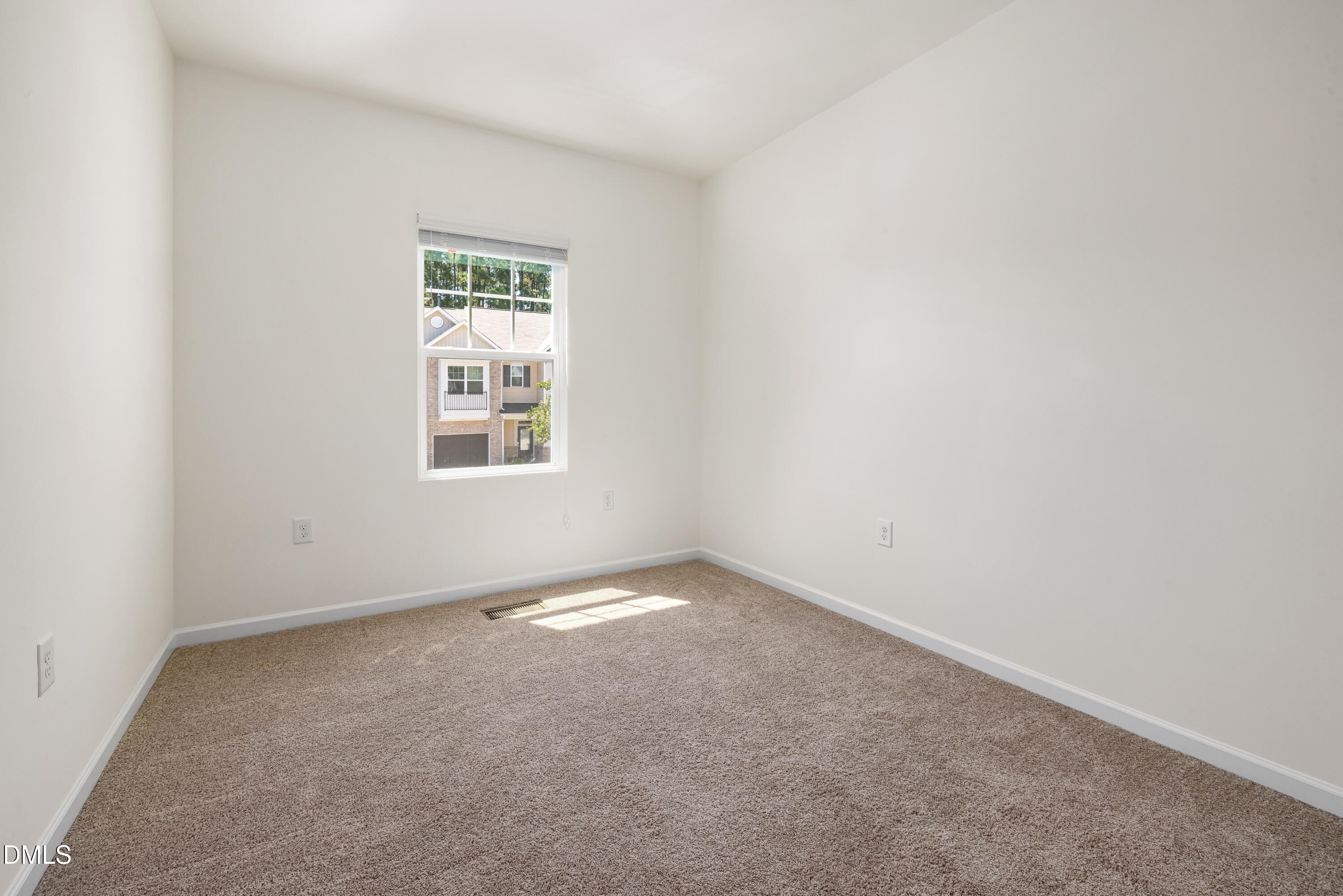 4351 Flintlock Lane Durham, NC 27704 - Photo 19 of 29 an empty room with a window