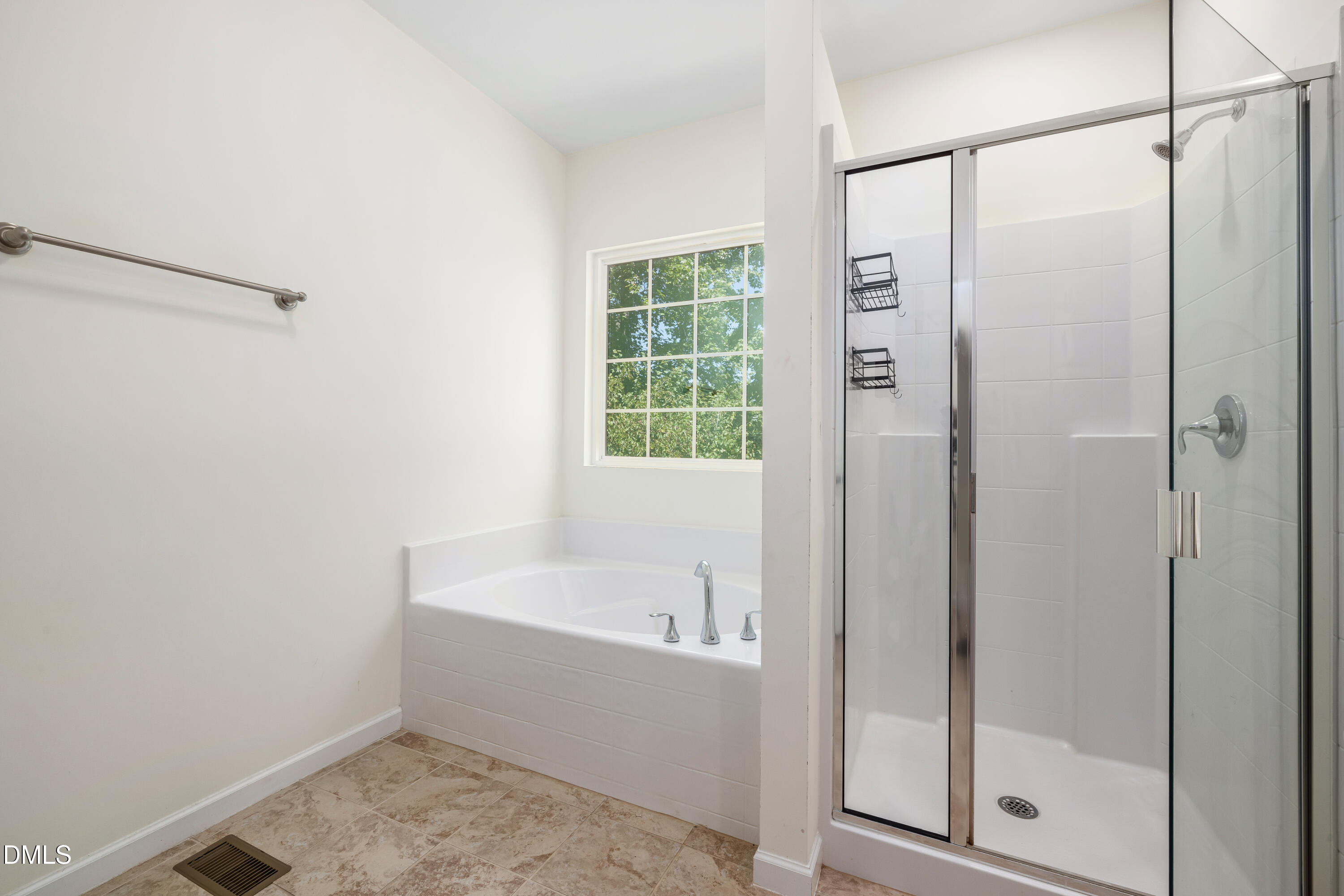 4351 Flintlock Lane Durham, NC 27704 - Photo 26 of 29 a bathroom with a bathtub and a shower