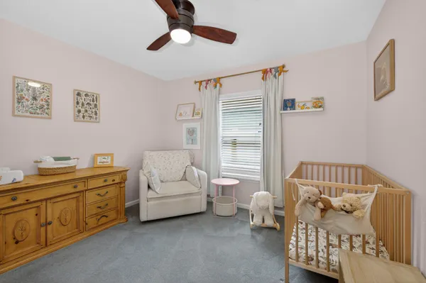 a bedroom with furniture and window