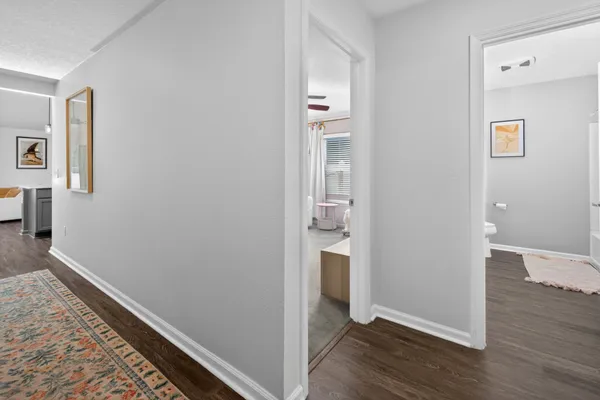 a view of hallway with wooden floor