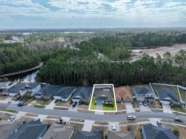 a view of yard with swimming pool and seating
