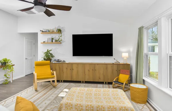 a living room with furniture and a flat screen tv