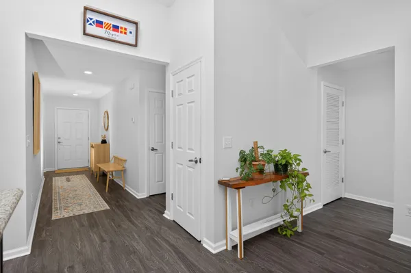 a living room with kitchen island furniture and a kitchen view