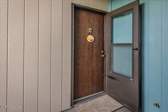 a room with closet and wooden floor