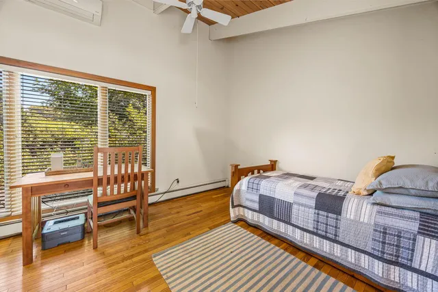 a view of kitchen with furniture and wooden floor