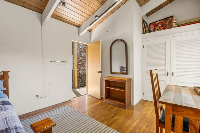 a view of balcony with wooden floor and outdoor space