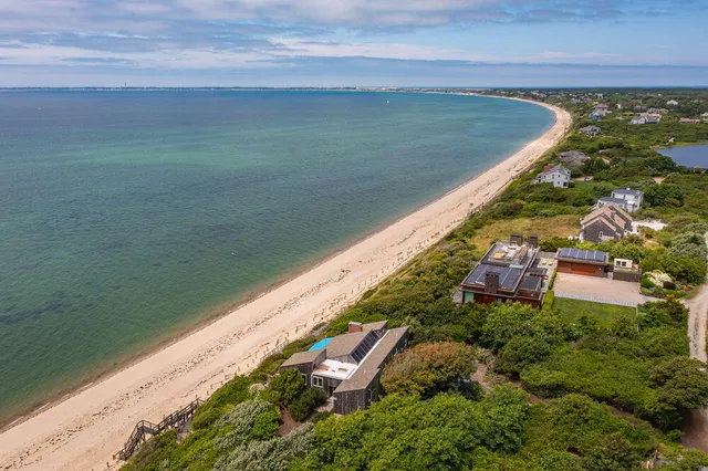 an aerial view of a house with a garden