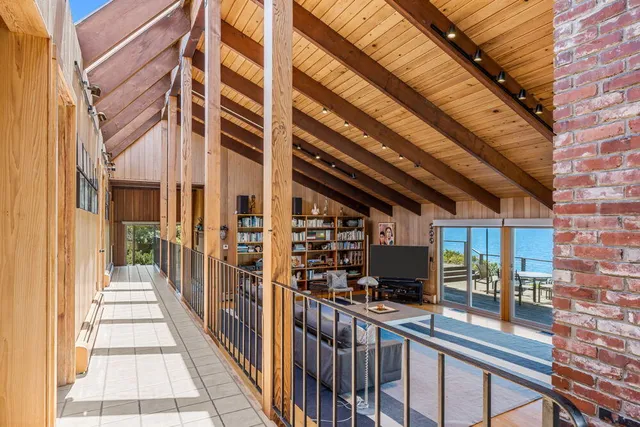 a living room with furniture a fireplace and a table