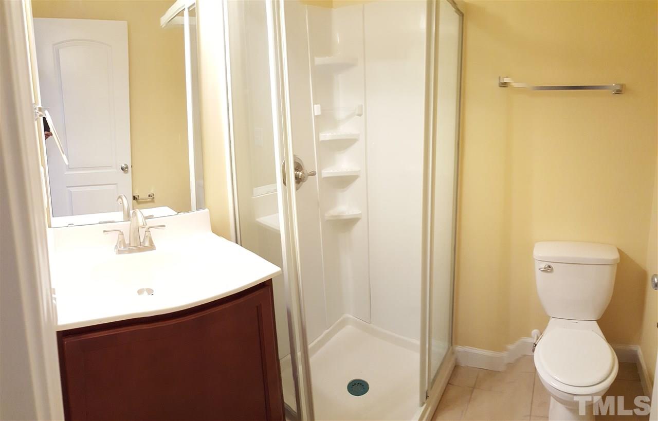 2131 Milburnie Road Raleigh, NC 27610 - Photo 4 of 4 a bathroom with a sink a toilet and shower