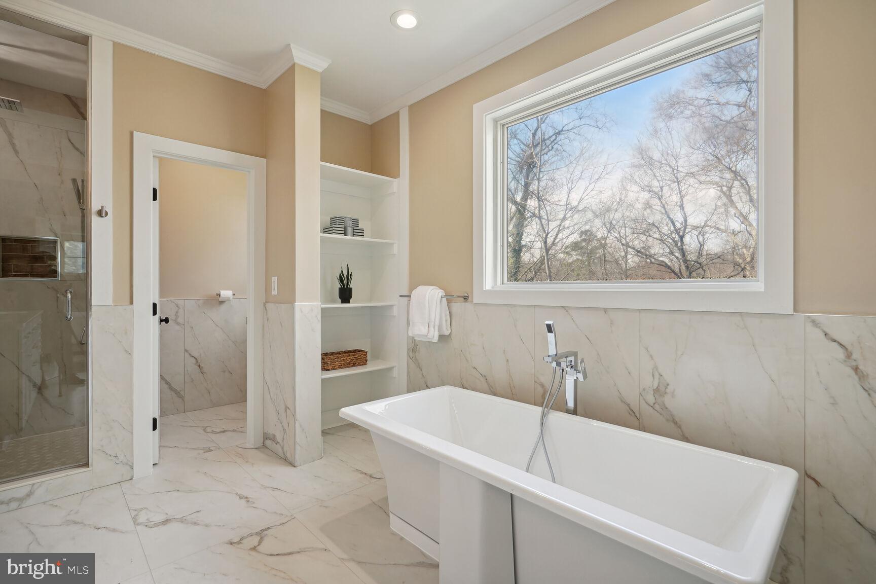 8616 Jones Mill Road Chevy Chase, MD 20815 - Photo 40 of 81 Kohler soaking tub, custom shelving and window