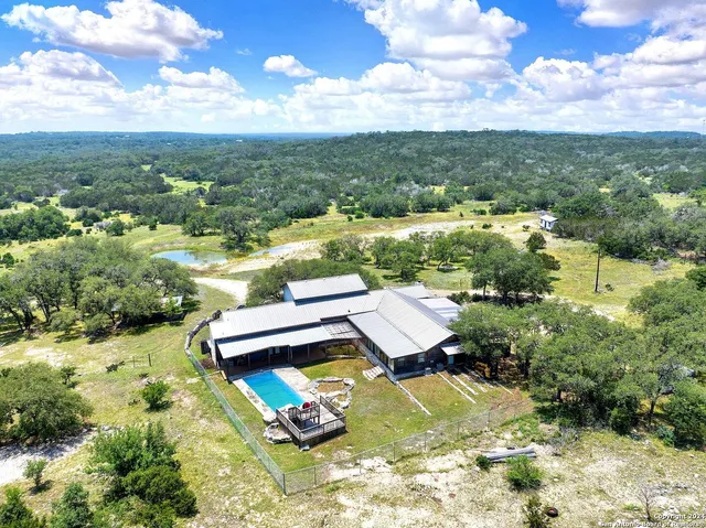 an aerial view of a house with a garden