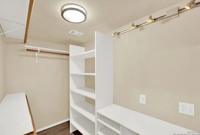 a bathroom with a shower a toilet and a sink