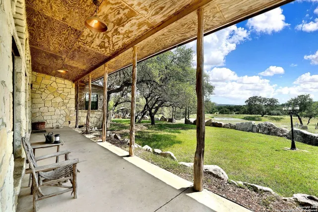 a view of a backyard with large trees