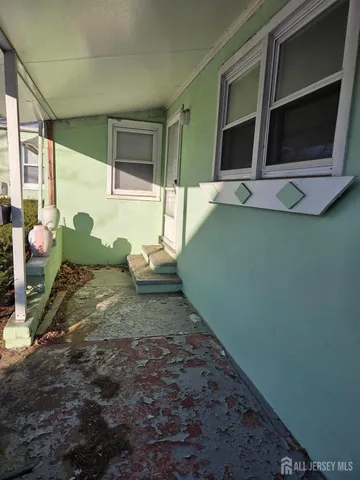 a living room with hard wood floor