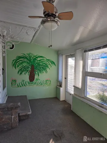 a room with window and ceiling fan