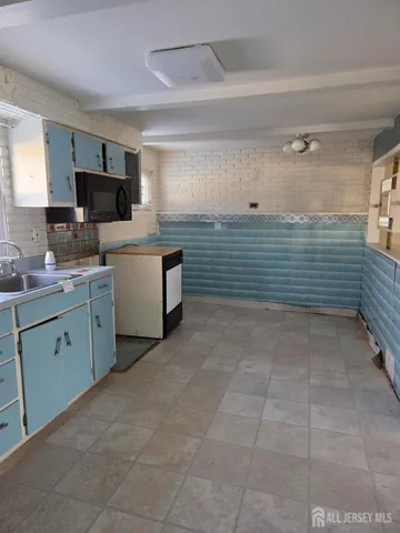 a room with cabinets and flat screen tv
