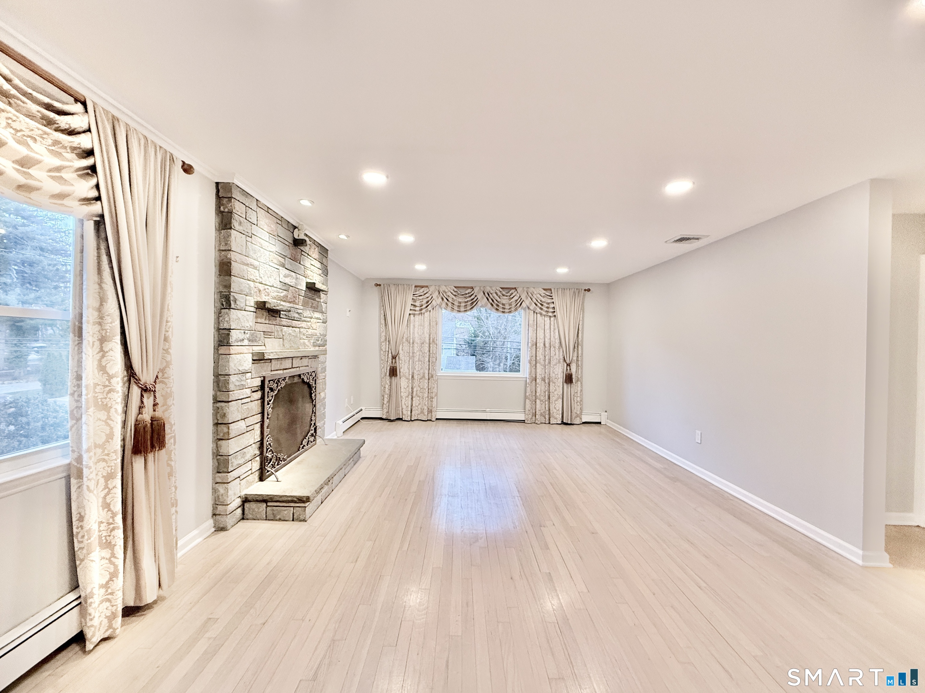 36 Center Drive Greenwich, CT 06870 - Photo 22 of 30 a view of an empty room with a fireplace