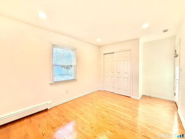 a view of a kitchen with a sink and microwave