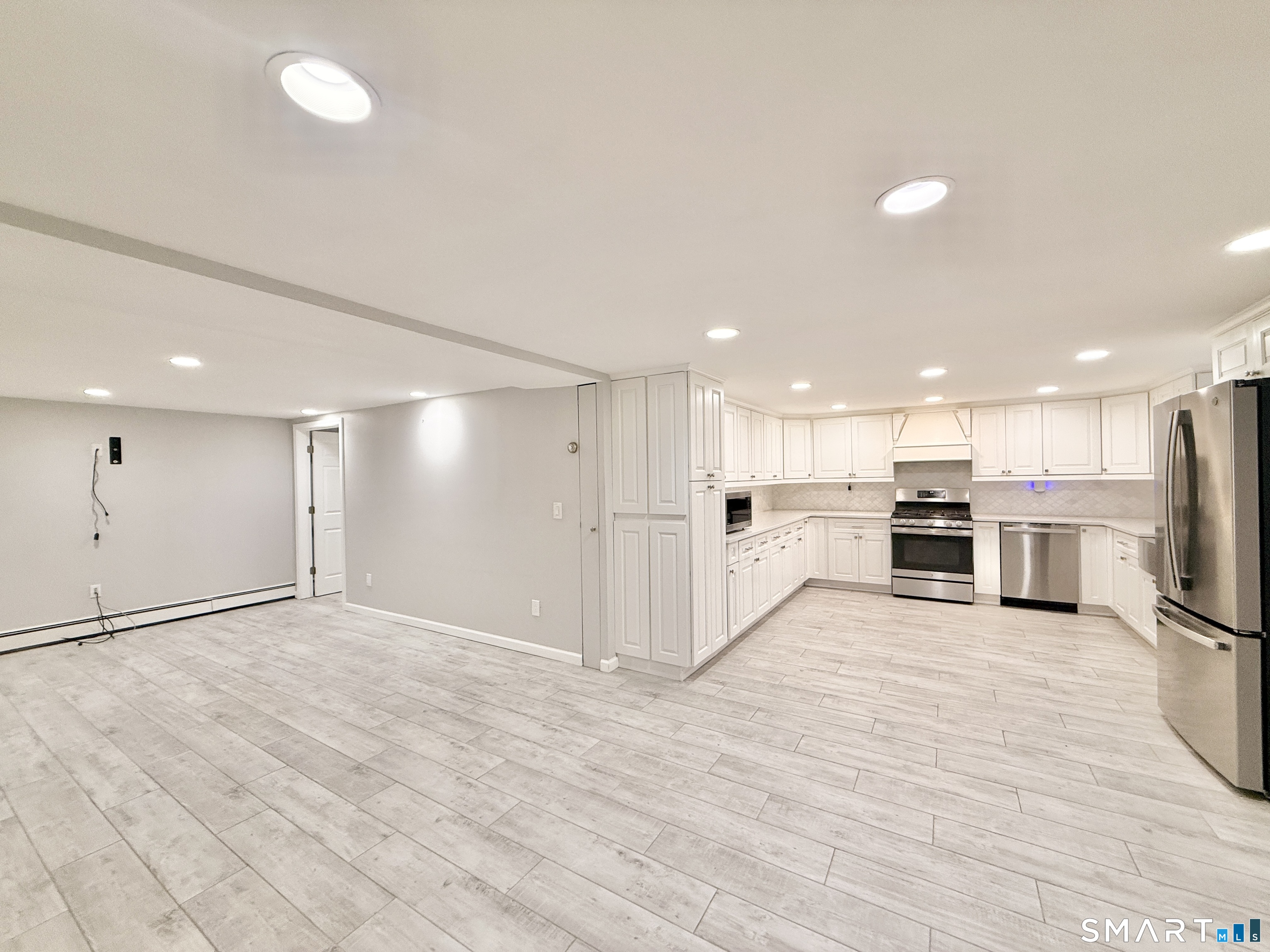 36 Center Drive Greenwich, CT 06870 - Photo 25 of 30 a view of a kitchen with a sink and microwave