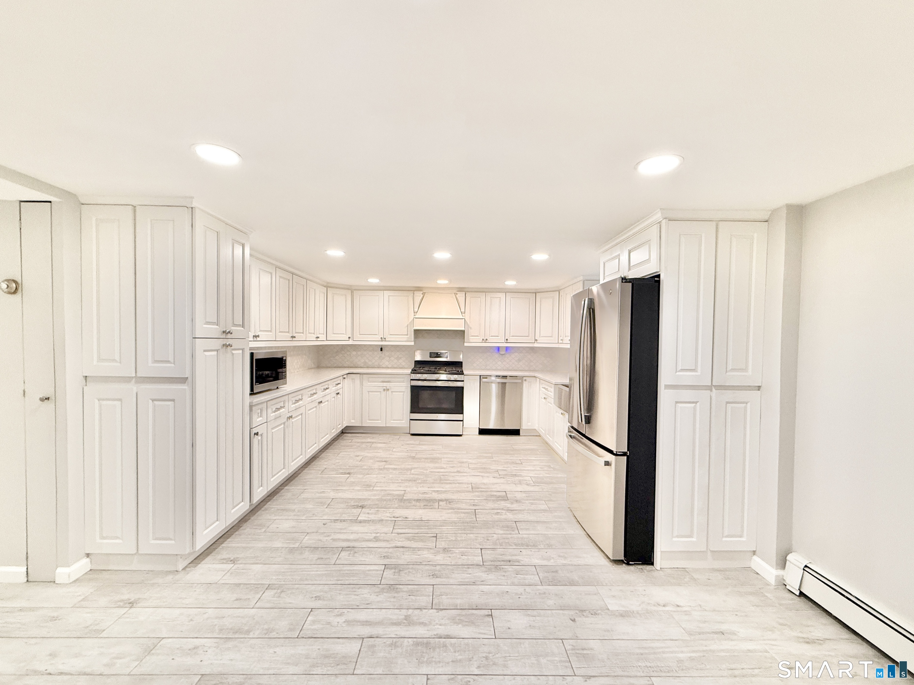 36 Center Drive Greenwich, CT 06870 - Photo 26 of 30 a view of a kitchen with wooden floor