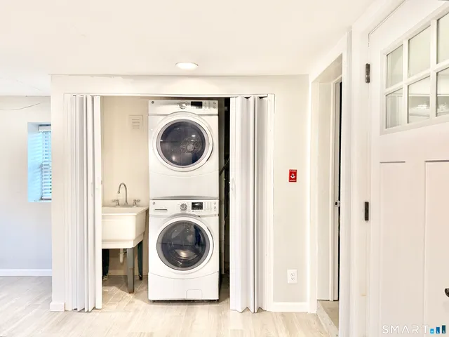 a view of an empty room with a fireplace
