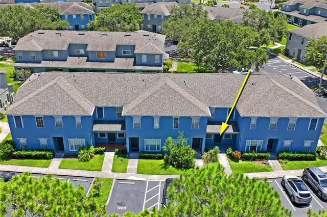 an aerial view of a house with a swimming pool